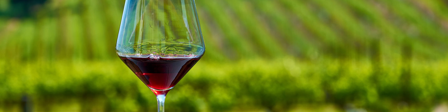 A glass of red wine created from a variety of organic grapes. 