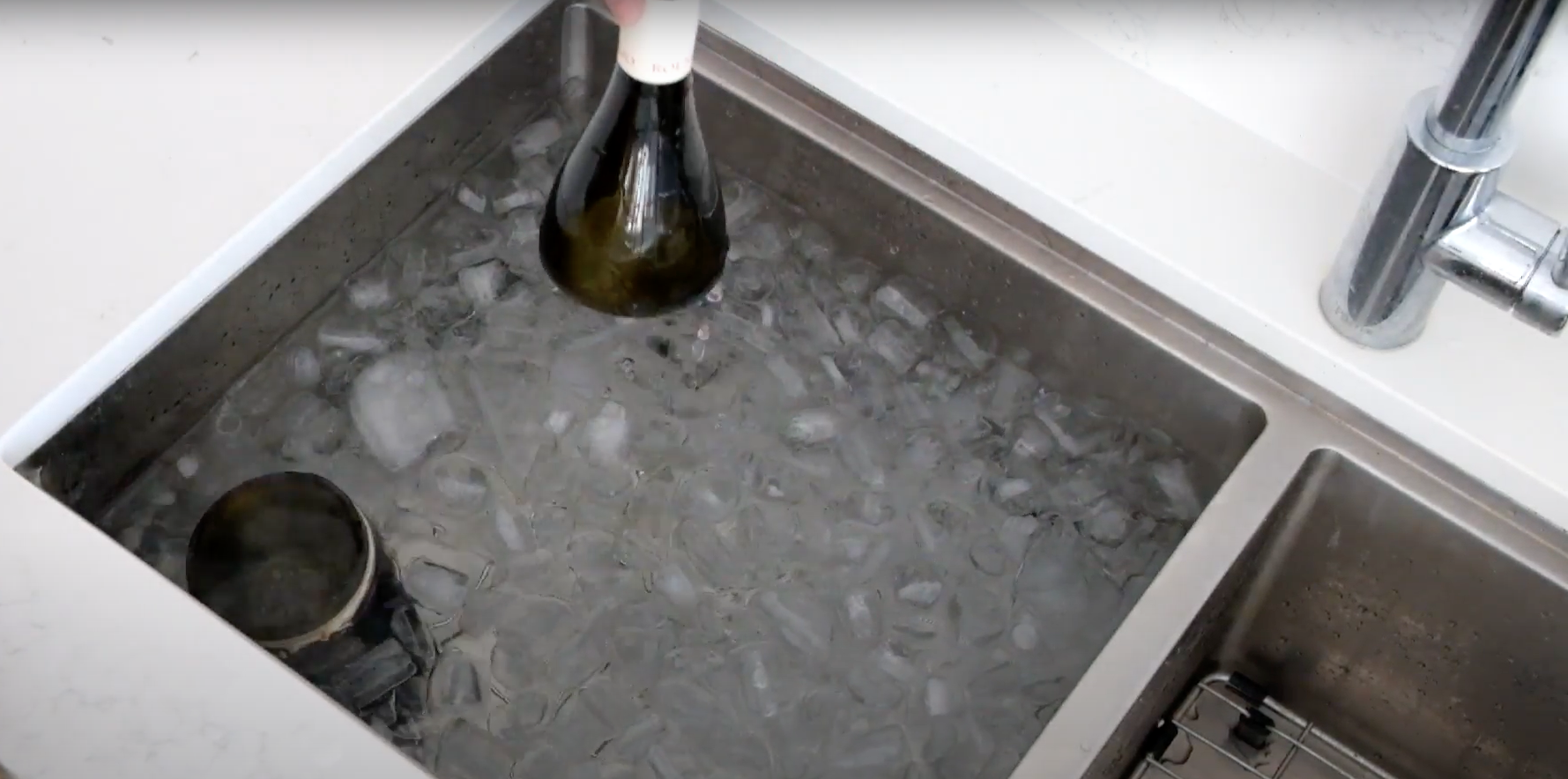 The wine bottle separated in the cold ice bath