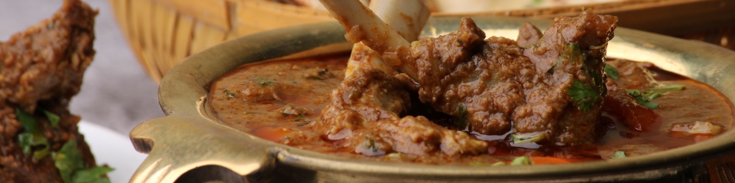 Close up shot of a bowl of spicy lamb vindaloo. 